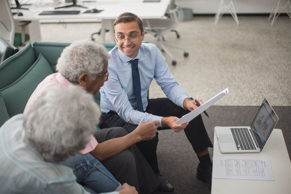 An advisor reviewing a policy in person with clients